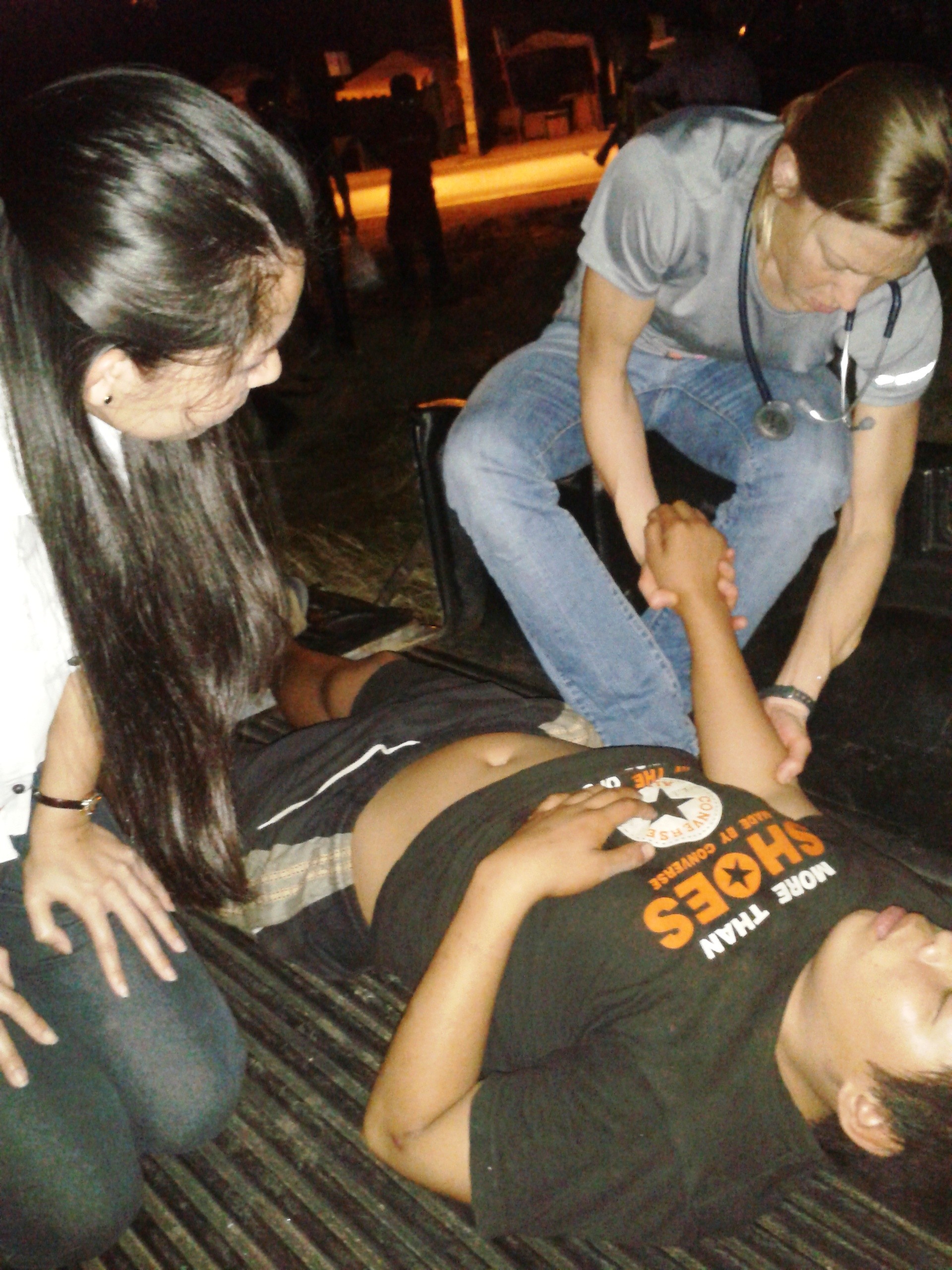 examining a kid in the bed of a truck